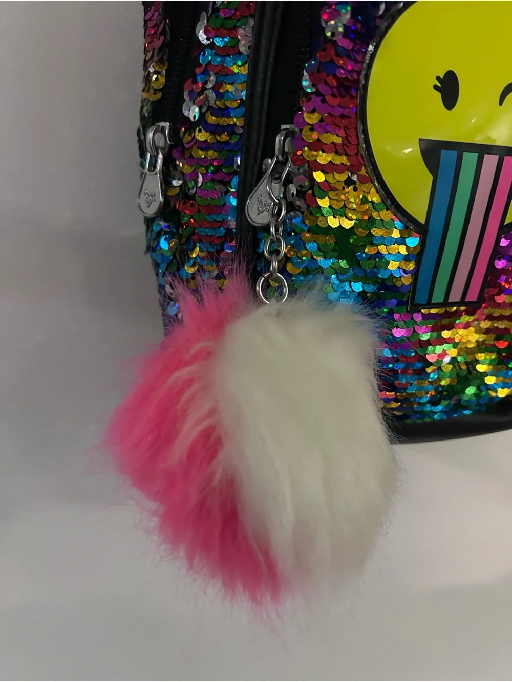 Justice Rainbow Sequin Backpack with Yellow Emoji and Pink Pom